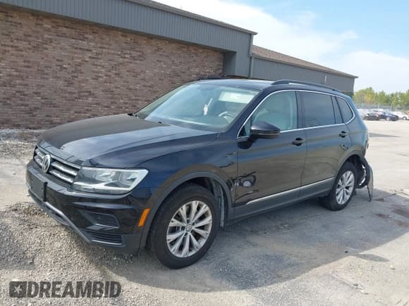✅ 2018 Volkswagen Tiguan SEL • VIN: 3VV2B7AX0JM084778 • Лот: 43200447. Опубликован ранее на IAAI с пробегом 77 889 миль. Бесплатный доступ к архиву аукционных продаж из США и подробный отчёт об истории автомобиля на DreamBid. Изображение 2.