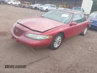✅ 1997 Lincoln Mark VIII LSC • VIN: 1LNLM92VXVY651560 • Лот: 42997856. Опубликован ранее на IAAI с пробегом 144 439 миль. Бесплатный доступ к архиву аукционных продаж из США и подробный отчёт об истории автомобиля на DreamBid. Изображение 2.
