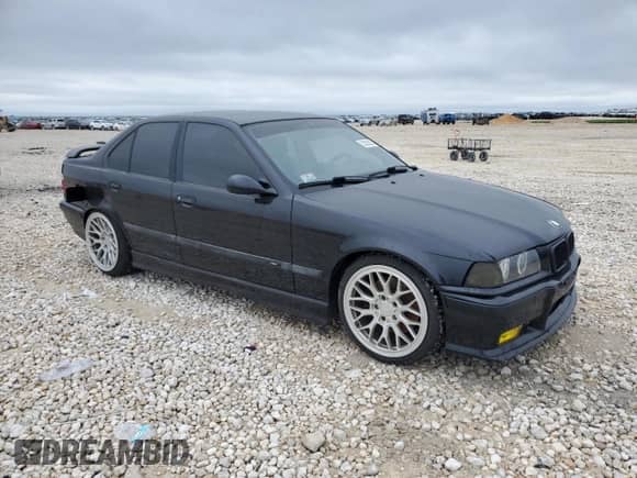 1998 BMW 3 Series M3s with VIN WBSCD9320WEE09027, listed as a Copart auction lot 52202055 with 244,452 mi miles and Clean title. Bid and sale history available at DreamBid. Image 4.