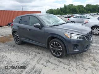 ✅ 2016 Mazda CX-5 Grand Touring • VIN: JM3KE2DY6G0895534 • Lot: 42621734. Wystawiony na IAAI z przebiegiem 173 294 mil. Bezpłatny archiwum sprzedaży aukcyjnych z USA i szczegółowy raport historii pojazdu na DreamBid. Zdjęcie 1.