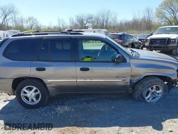 ✅ 2006 GMC Envoy SLE • VIN: 1GKDT13S662122195 • Lot: 42228257. Listed on IAAI with 177,365 mi. Free auction sales archive from the USA and detailed vehicle history report at DreamBid. Image 14.
