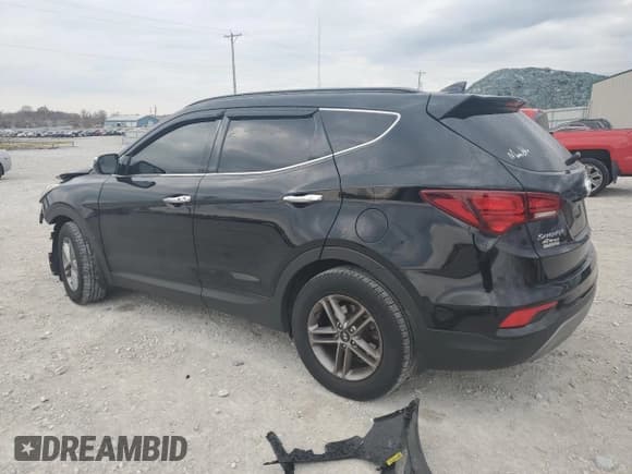 ✅ 2018 Hyundai Santa Fe 2.4L • VIN: 5XYZUDLB4JG563810 • Лот: 77243283. Опубликован ранее на Copart с пробегом 70 150 миль. Бесплатный доступ к архиву аукционных продаж из США и подробный отчёт об истории автомобиля на DreamBid. Изображение 2.