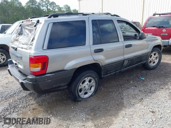 ✅ 2000 Jeep Grand Cherokee Laredo • VIN: 1J4G248S5YC299897 • Lot: 41944724. Listed on IAAI with Not provided. Free auction sales archive from the USA and detailed vehicle history report at DreamBid. Image 4.