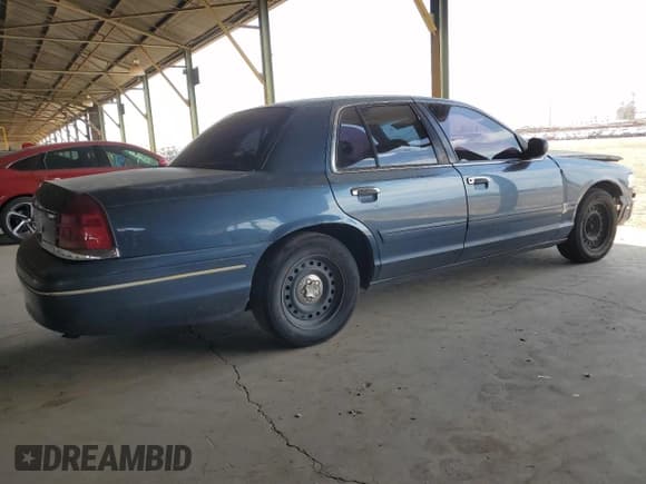 ✅ 1998 Ford Crown Victoria • VIN: 2FAFP73W1WX101613 • Лот: 56297924. Опубликован ранее на Copart с пробегом 267 191 миль. Бесплатный доступ к архиву аукционных продаж из США и подробный отчёт об истории автомобиля на DreamBid. Изображение 3.