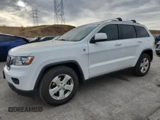 ✅ 2013 Jeep Grand Cherokee Laredo • VIN: 1C4RJFAG3DC592212 • Lot: 91908805. Listed on Copart with 183,089 mi. Free auction sales archive from the USA and detailed vehicle history report at DreamBid. Image 1.