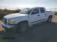 2005 Dodge Dakota SLT with VIN 1D7HE48N05S112861, listed as a Copart auction lot 76417804 with 165,870 mi miles and Salvage title. Bid and sale history available at DreamBid. Image 1.