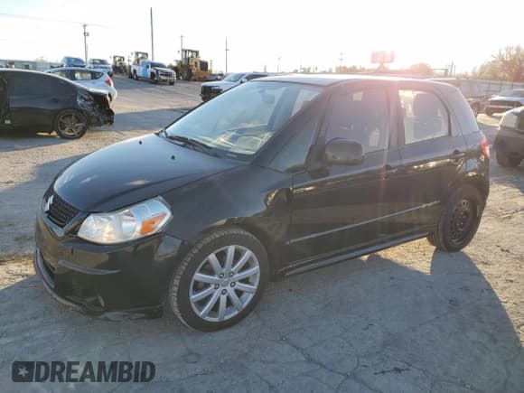 ✅ 2012 Suzuki SX4 Sportback • VIN: JS2YA5A51C6300757 • Лот: 84345314. Опубликован ранее на Copart с пробегом 148 073 миль. Бесплатный доступ к архиву аукционных продаж из США и подробный отчёт об истории автомобиля на DreamBid. Изображение 1.