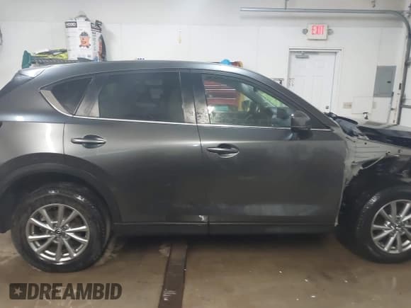 ✅ 2022 Mazda CX-5 S Carbon Edition • VIN: JM3KFBCM1N0577670 • Лот: 43821338. Опубликован ранее на IAAI с пробегом 59 967 миль. Бесплатный доступ к архиву аукционных продаж из США и подробный отчёт об истории автомобиля на DreamBid. Изображение 13.
