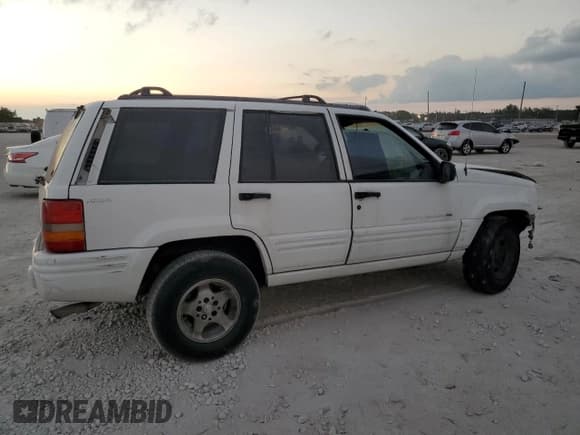 ✅ 1998 Jeep Grand Cherokee Laredo • VIN: 1J4GZ48S8WC313204 • Lot: 93124765. Listed on Copart with Not provided. Free auction sales archive from the USA and detailed vehicle history report at DreamBid. Image 3.