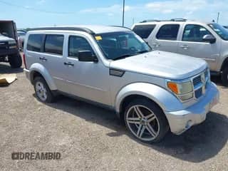 2008 Dodge Nitro SLT z VIN 1D8GT58KX8W100870, wystawiony jako IAAI lot #42520804 z przebiegiem 167 043 mil mil oraz . Historia ofert i sprzedaży dostępna na DreamBid. Obrazek 1.