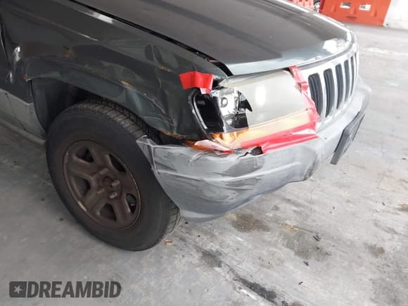 ✅ 2002 Jeep Grand Cherokee Laredo • VIN: 1J4GW48NX2C196495 • Lot: 42781267. Listed on IAAI with 209,655 mi. Free auction sales archive from the USA and detailed vehicle history report at DreamBid. Image 6.