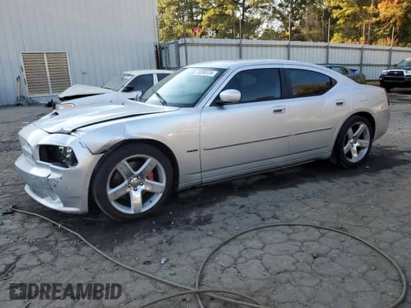 2007 Dodge Charger SRT-8 с VIN 2B3LA73W17H787535, выставлен на аукционе Copart как лот 78386124 с пробегом 173 263 миль миль и Списание • Salvage title. История ставок и продаж доступна на DreamBid. Изображение 1.