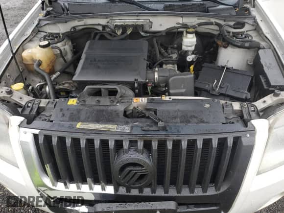 2010 Mercury Mariner Premier с VIN 4M2CN9HG1AKJ28171, выставлен на аукционе Copart как лот 80882805 с пробегом 124 347 миль миль и Списание • Salvage title. История ставок и продаж доступна на DreamBid. Изображение 12.