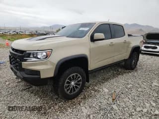 ✅ 2021 Chevrolet Colorado 4WD ZR2 • VIN: 1GCGTEENXM1245461 • Лот: 70220815. Опубликован ранее на Copart с пробегом 7 142 миль. Бесплатный доступ к архиву аукционных продаж из США и подробный отчёт об истории автомобиля на DreamBid. Изображение 1.