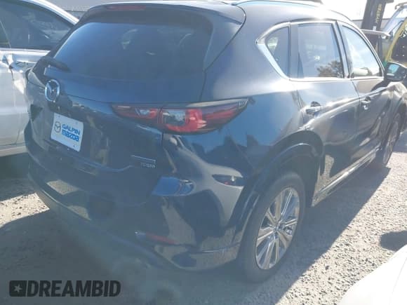 ✅ 2022 Mazda CX-5 Signature • VIN: JM3KFBXY7N0569456 • Lot: 43713830. Listed on IAAI with 48,420 mi. Free auction sales archive from the USA and detailed vehicle history report at DreamBid. Image 4.