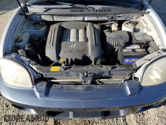 2002 Hyundai Santa Fe GLS z VIN KM8SC73D92U182330, wystawiony jako Copart lot #41827535 z przebiegiem 177 157 mil mil oraz Szkoda całkowita • Salvage title. Historia ofert i sprzedaży dostępna na DreamBid. Obrazek 11.