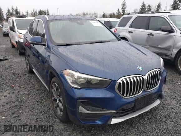 ✅ 2022 BMW X1 xDrive28i • VIN: WBXJG9C09N5V21019 • Lot: 41582490. Listed on IAAI with 21,514 mi. Free auction sales archive from the USA and detailed vehicle history report at DreamBid. Image 1.