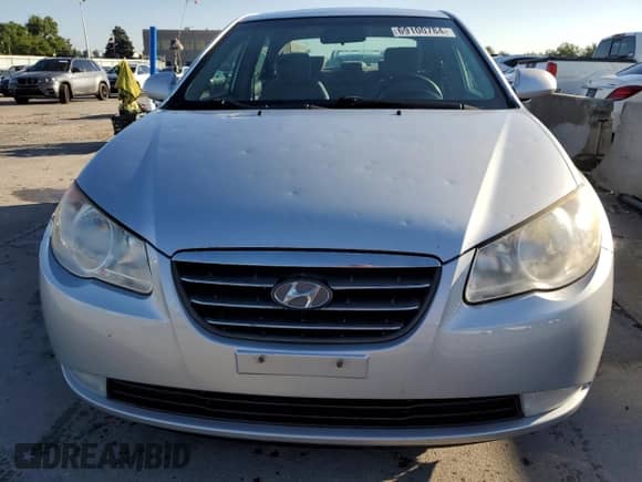 2007 Hyundai Elantra GLS z VIN KMHDU46D47U158427, wystawiony jako Copart lot #69100784 z przebiegiem 169 388 mil mil oraz Czysty tytuł • Clean title. Historia ofert i sprzedaży dostępna na DreamBid. Obrazek 5.