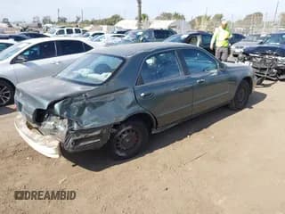 ✅ 1998 Mazda 626 DX • VIN: 1YVGF22C2W5691764 • Lot: 43677590. Wystawiony na IAAI z przebiegiem 142 191 mil. Bezpłatny archiwum sprzedaży aukcyjnych z USA i szczegółowy raport historii pojazdu na DreamBid. Zdjęcie 4.