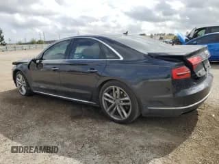 ✅ 2015 Audi A8 4.0T • VIN: WAUJ2AFD5FN013267 • Лот: 39065654. Опубликован ранее на Copart с пробегом 64 541 миль. Бесплатный доступ к архиву аукционных продаж из США и подробный отчёт об истории автомобиля на DreamBid. Изображение 2.