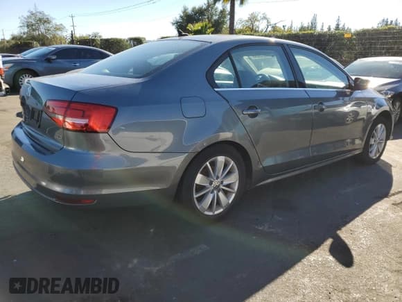 ✅ 2015 Volkswagen Jetta SE • VIN: 3VWD17AJ7FM268058 • Lot: 85205095. Listed on Copart with 64,778 mi. Free auction sales archive from the USA and detailed vehicle history report at DreamBid. Image 3.