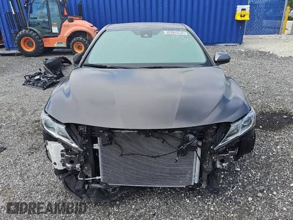 2023 Toyota Camry Hybrid LE with VIN 4T1C31AK3PU608653, listed as a Copart auction lot 59235965 with 57,095 mi miles and Clean title. Bid and sale history available at DreamBid. Image 5.