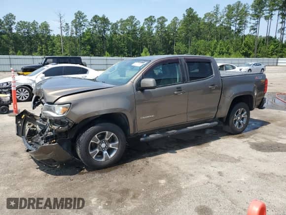 2017 Chevrolet Colorado 4WD Z71 z VIN 1GCGTDENXH1222200, wystawiony jako Copart lot #62007605 z przebiegiem 95 795 mil mil oraz Szkoda całkowita • Salvage title. Historia ofert i sprzedaży dostępna na DreamBid. Obrazek 1.