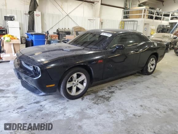 ✅ 2012 Dodge Challenger SXT • VIN: 2C3CDYAG4CH204297 • Lot: 84712494. Wystawiony na Copart z przebiegiem 180 580 mil. Bezpłatny archiwum sprzedaży aukcyjnych z USA i szczegółowy raport historii pojazdu na DreamBid. Zdjęcie 1.