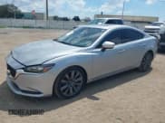 ✅ 2018 Mazda 6 Grand Touring • VIN: JM1GL1TY4J1318311 • Lot: 43240836. Listed on IAAI with 101,987 mi. Free auction sales archive from the USA and detailed vehicle history report at DreamBid. Image 2.