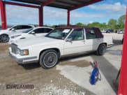 ✅ 1988 Cadillac DeVille • VIN: 1G6CD5154J4297778 • Lot: 41611765. Wystawiony na IAAI z przebiegiem 92 434 mil. Bezpłatny archiwum sprzedaży aukcyjnych z USA i szczegółowy raport historii pojazdu na DreamBid. Zdjęcie 14.