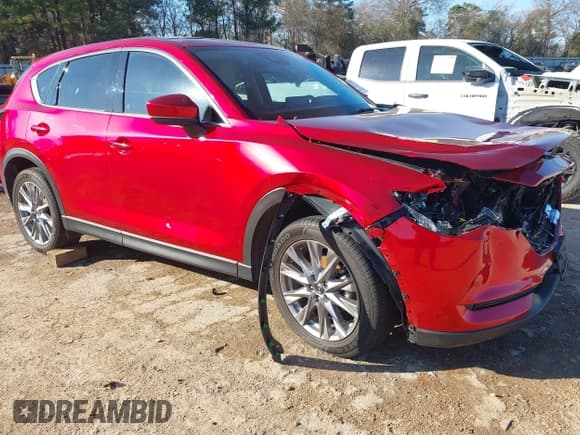 ✅ 2021 Mazda CX-5 Grand Touring • VIN: JM3KFADM9M0300787 • Lot: 41231871. Listed on IAAI with 54,474 mi. Free auction sales archive from the USA and detailed vehicle history report at DreamBid. Image 1.