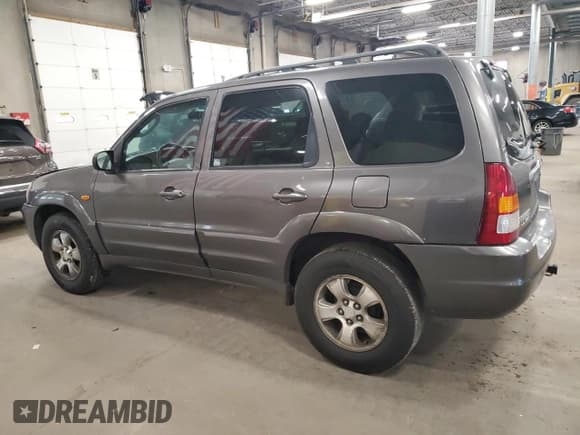 ✅ 2003 Mazda Tribute LX • VIN: 4F2YZ04173KM05549 • Lot: 86702895. Listed on Copart with 128,757 mi. Free auction sales archive from the USA and detailed vehicle history report at DreamBid. Image 2.