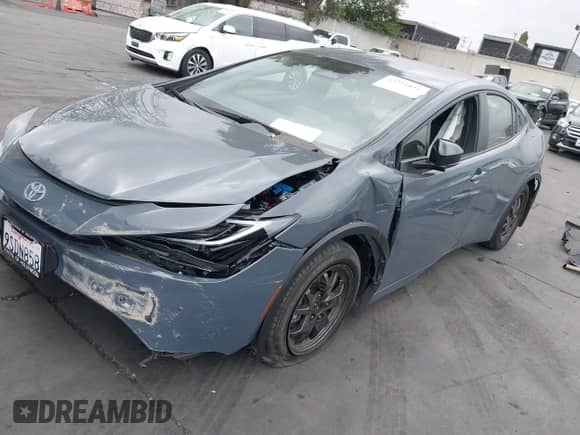 2024 Toyota Prius LE with VIN JTDACAAU6R3046057, listed as a IAAI auction lot 43316816 with 14,220 mi miles and . Bid and sale history available at DreamBid. Image 2.