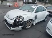 ✅ 2016 Volkswagen Beetle SE • VIN: 3VWJ17ATXGM614853 • Лот: 43628416. Опубликован ранее на IAAI с пробегом 66 179 миль. Бесплатный доступ к архиву аукционных продаж из США и подробный отчёт об истории автомобиля на DreamBid. Изображение 19.