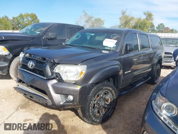 ✅ 2015 Toyota Tacoma • VIN: 5TFLU4EN8FX119895 • Lot: 43670596. Listed on IAAI with 185,866 mi. Free auction sales archive from the USA and detailed vehicle history report at DreamBid. Image 2.