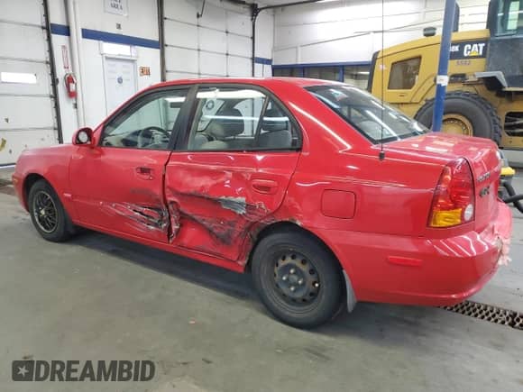 2005 Hyundai Accent GLS with VIN KMHCG45C05U661607, listed as a Copart auction lot 71812814 with 238,630 mi miles and Salvage title. Bid and sale history available at DreamBid. Image 2.