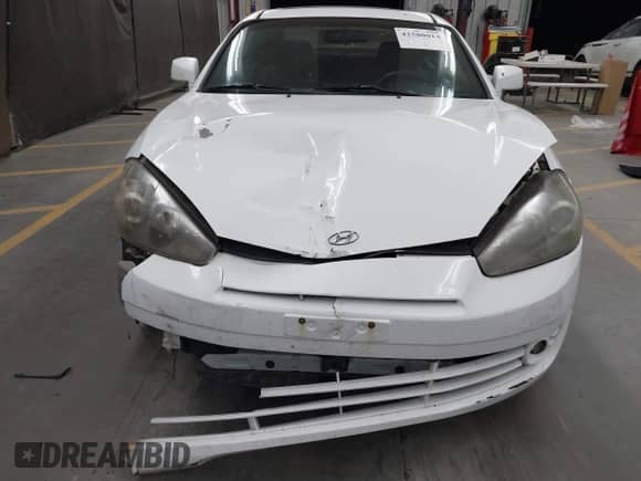 2008 Hyundai Tiburon GS с VIN KMHHM66D98U280005, выставлен на аукционе IAAI как лот 42580014 с пробегом 267 858 миль миль и . История ставок и продаж доступна на DreamBid. Изображение 6.