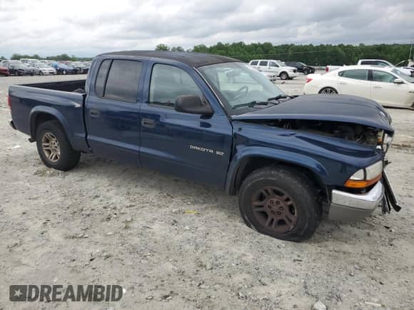 2002 Dodge Dakota SLT z VIN 1B7HL48X92S548573, wystawiony jako Copart lot #55357085 z przebiegiem 252 742 mil mil oraz Szkoda całkowita • Salvage title. Historia ofert i sprzedaży dostępna na DreamBid. Obrazek 4.