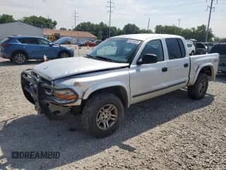 2003 Dodge Dakota SLT z VIN 1D7HG48N73S127509, wystawiony jako Copart lot #65515595 z przebiegiem 161 928 mil mil oraz Szkoda całkowita • Salvage title. Historia ofert i sprzedaży dostępna na DreamBid. Obrazek 1.