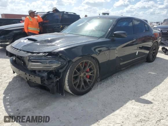 2015 Dodge Charger SRT Hellcat z VIN 2C3CDXL91FH795556, wystawiony jako Copart lot #77477774 z przebiegiem Nie podano mil oraz Szkoda całkowita • Salvage title. Historia ofert i sprzedaży dostępna na DreamBid. Obrazek 1.