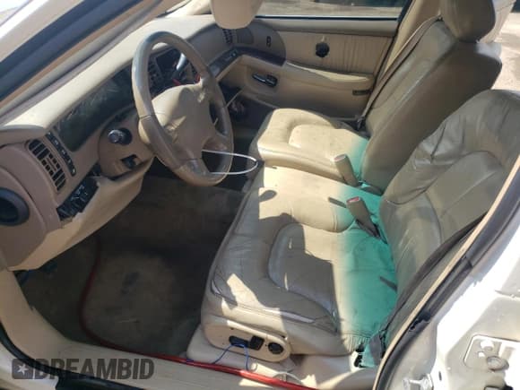 ✅ 2004 Buick Park Avenue • VIN: 1G4CW54K144140136 • Lot: 71315704. Listed on Copart with 215,069 mi. Free auction sales archive from the USA and detailed vehicle history report at DreamBid. Image 7.