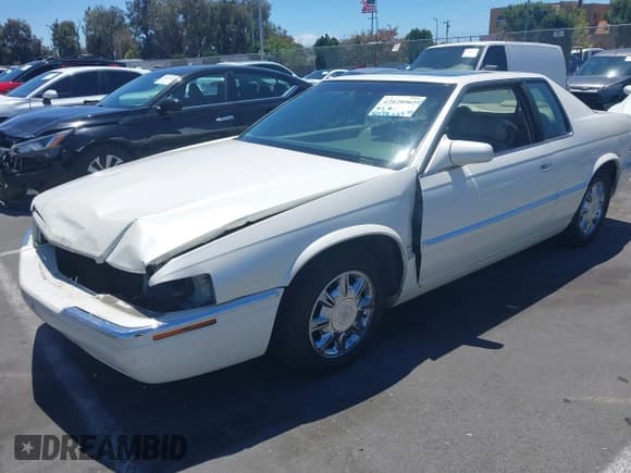 ✅ 1997 Cadillac Eldorado Touring • VIN: 1G6ET1294VU613949 • Lot: 42828965. Wystawiony na IAAI z przebiegiem 90 199 mil. Bezpłatny archiwum sprzedaży aukcyjnych z USA i szczegółowy raport historii pojazdu na DreamBid. Zdjęcie 2.