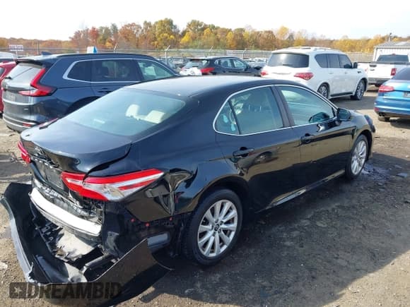 ✅ 2018 Toyota Camry LE • VIN: 4T1B11HK2JU674609 • Lot: 43590764. Listed on IAAI with 106,738 mi. Free auction sales archive from the USA and detailed vehicle history report at DreamBid. Image 4.
