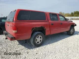 2000 Dodge Dakota z VIN 1B7GG2AX3YS622318, wystawiony jako Copart lot #75802284 z przebiegiem 244 003 mil mil oraz Czysty tytuł • Clean title. Historia ofert i sprzedaży dostępna na DreamBid. Obrazek 3.