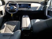 ✅ 2025 BMW iX xDrive50 • VIN: WB523CF09SCS15673 • Lot: 71554735. Listed on Copart with 11,593 mi. Free auction sales archive from the USA and detailed vehicle history report at DreamBid. Image 8.