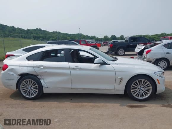 ✅ 2015 BMW 4 Series 428i xDrive • VIN: WBA4A7C51FD415440 • Lot: 42378459. Listed on IAAI with 116,445 mi. Free auction sales archive from the USA and detailed vehicle history report at DreamBid. Image 13.