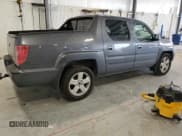 ✅ 2011 Honda Ridgeline RTL • VIN: 5FPYK1F5XBB006552 • Lot: 84037425. Listed on Copart with 167,548 mi. Free auction sales archive from the USA and detailed vehicle history report at DreamBid. Image 3.