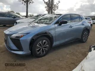 ✅ 2023 Lexus RZ 450e Premium • VIN: JTJAAAAB1PA005958 • Lot: 80736244. Wystawiony na Copart z przebiegiem 21 413 mil. Bezpłatny archiwum sprzedaży aukcyjnych z USA i szczegółowy raport historii pojazdu na DreamBid. Zdjęcie 1.