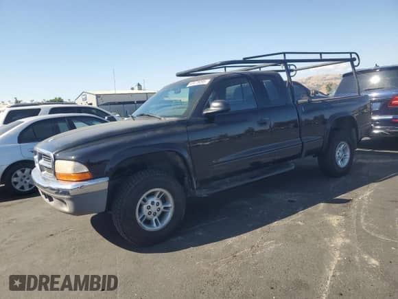 1999 Dodge Dakota SLT z VIN 1B7GG22X6XS166330, wystawiony jako Copart lot #63678095 z przebiegiem 241 272 mil mil oraz Szkoda całkowita • Salvage title. Historia ofert i sprzedaży dostępna na DreamBid. Obrazek 1.