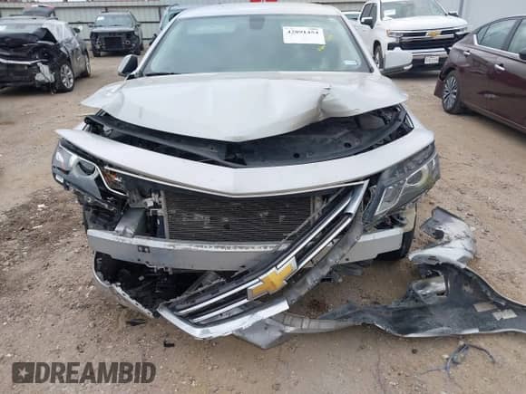 2018 Chevrolet Impala Premier z VIN 2G1125S31J9147320, wystawiony jako IAAI lot #42891454 z przebiegiem Nie podano mil oraz . Historia ofert i sprzedaży dostępna na DreamBid. Obrazek 11.